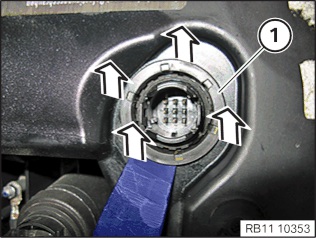 Use a plastic trim removal tool to remove the gasket from the cylinder head cover