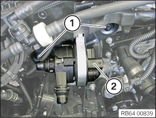 remove the two torx bolts anchoring the auxiliary coolant pump to engine
