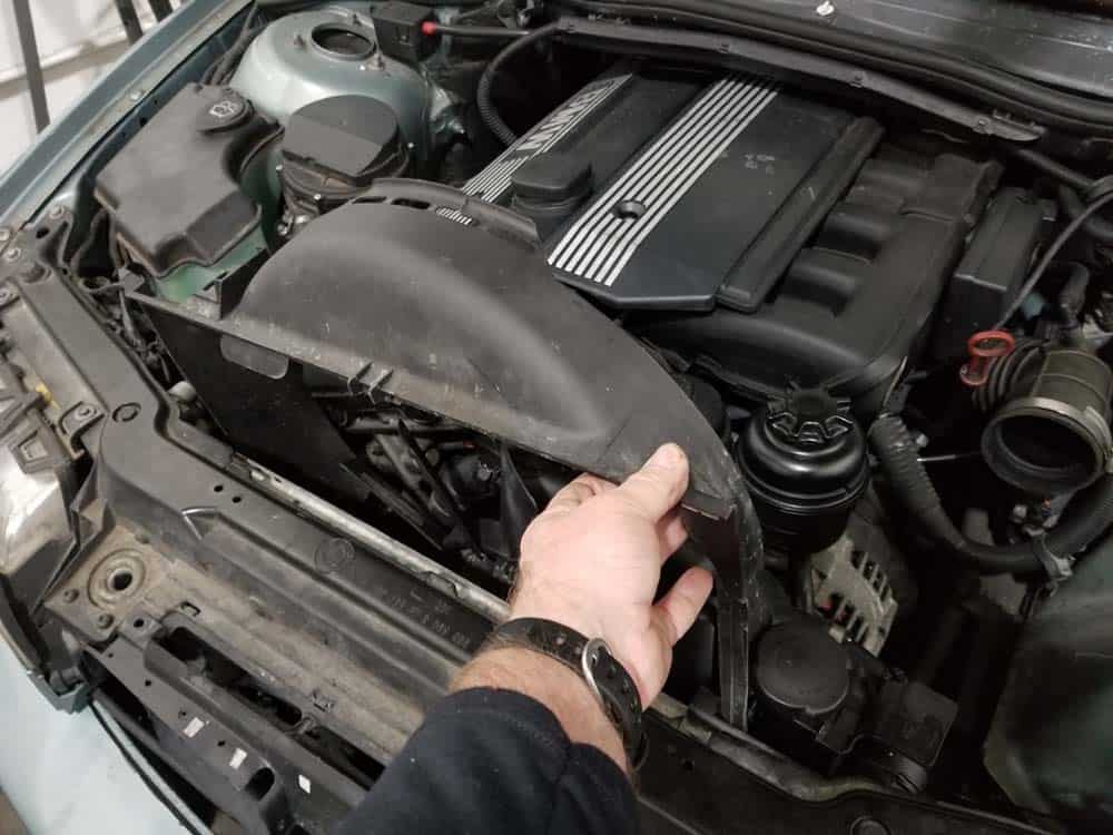 Remove the fan shroud from the engine if the clutch nut is frozen.