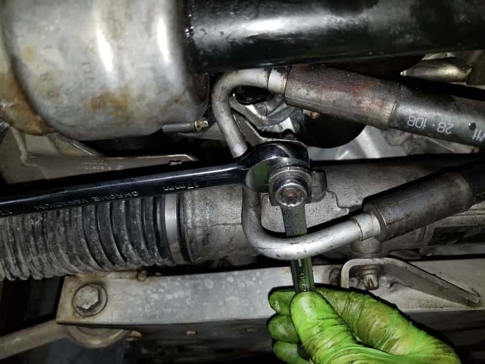 bmw e90 water pump replacement - Remove the power steering line.
