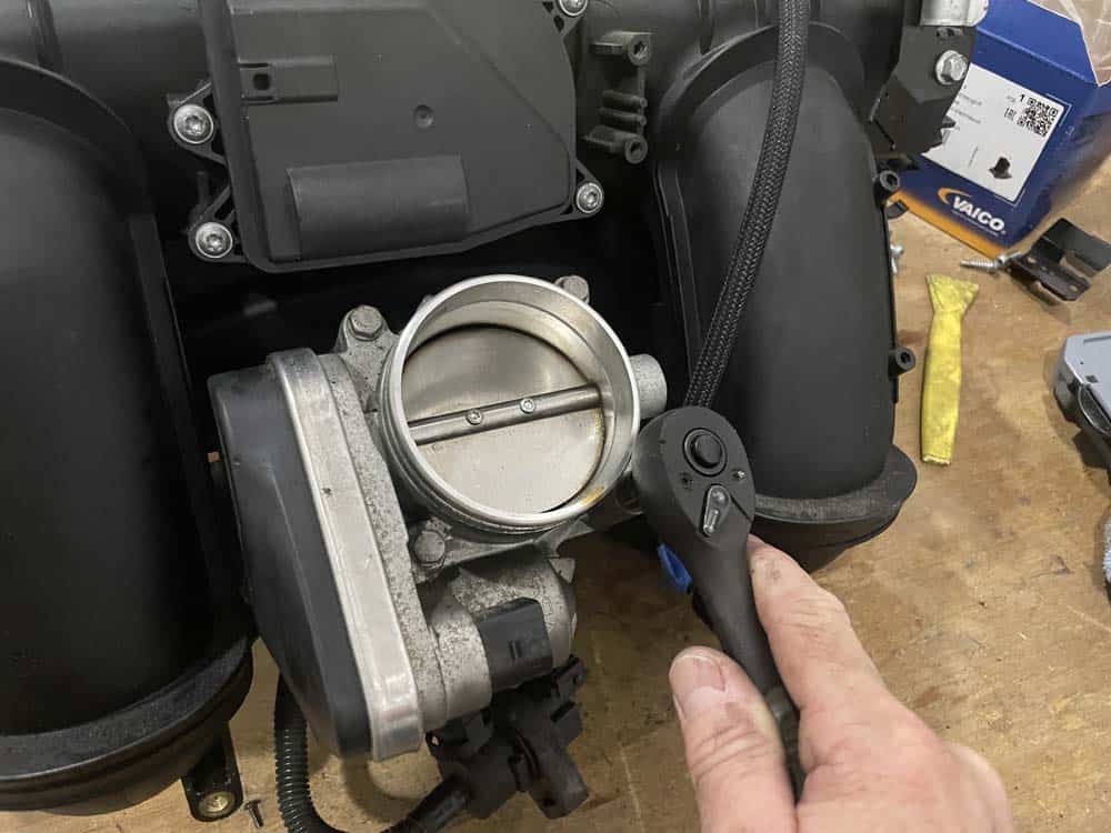 bmw n52 disa valve repair - remove the four throttle body bolts