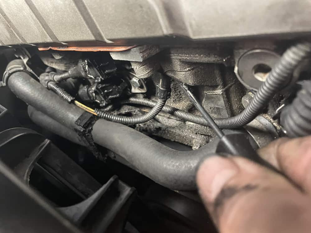 bmw n52 camshaft sensor replacement - use a metal pick to align the mounting hole with the threads in the cylinder head