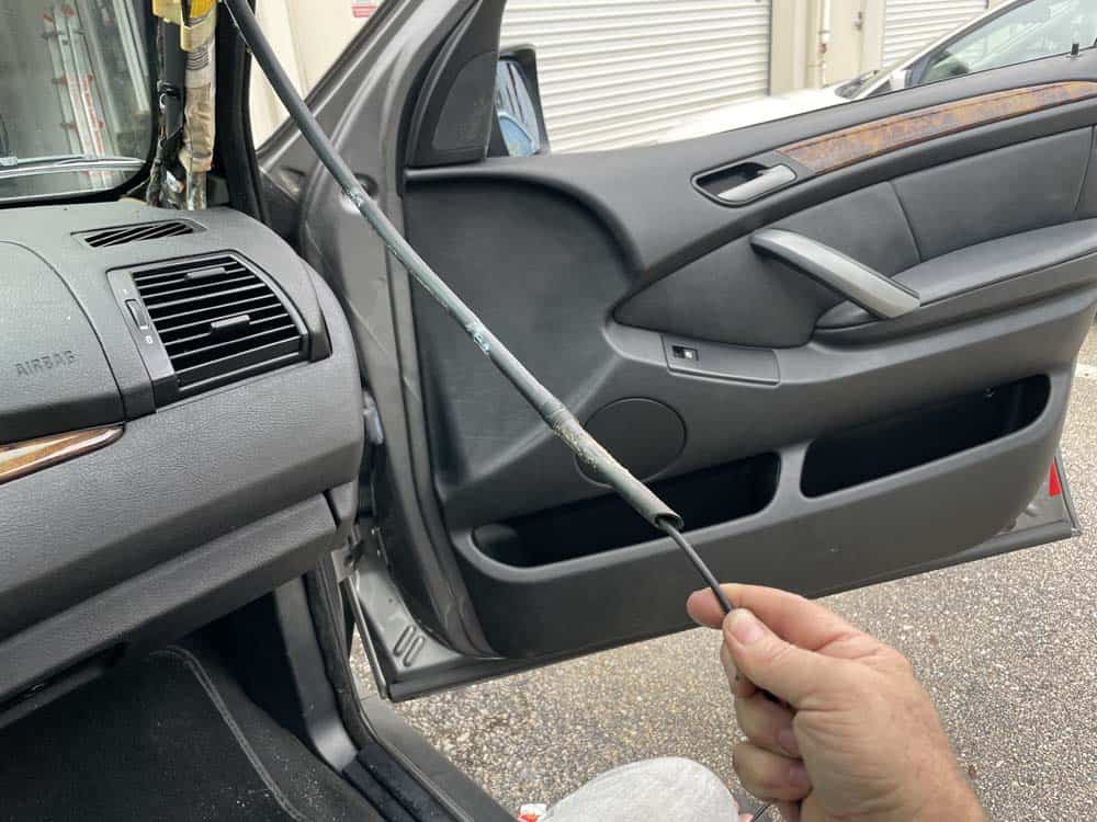 bmw e53 sunroof leak and drain cleaning - Snake out the rubber drain line up to the roof drain