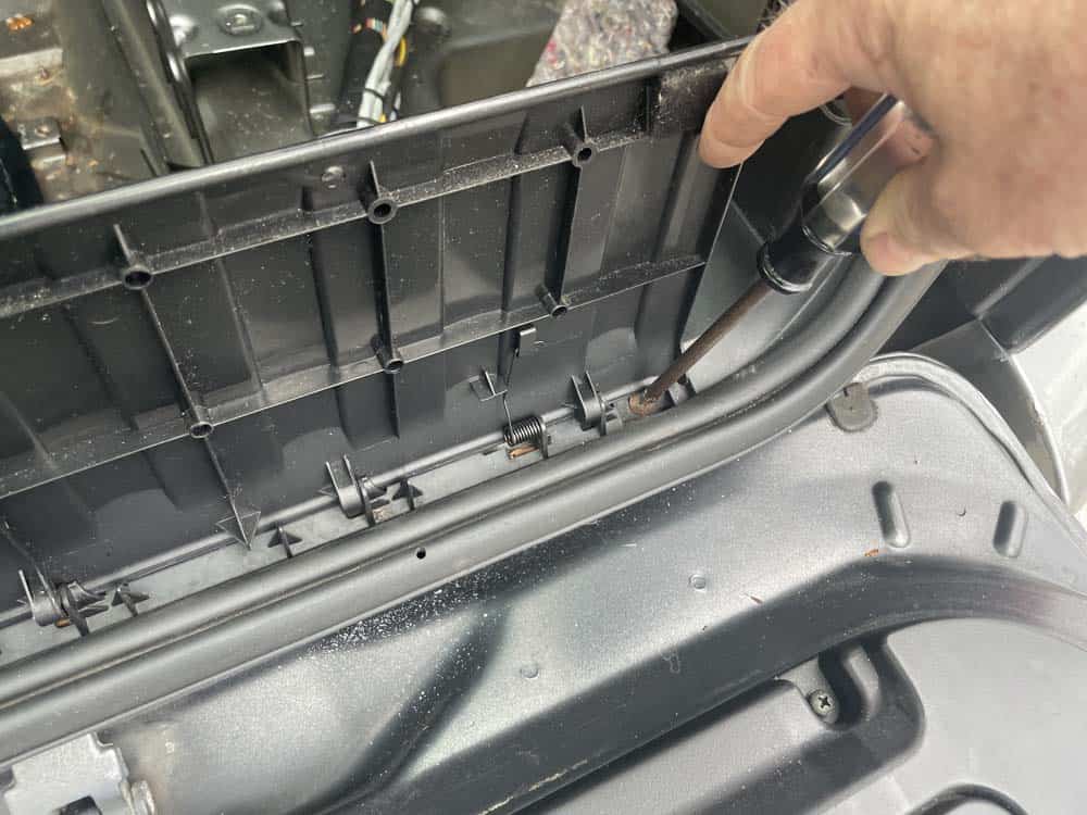 bmw e53 sunroof leak and drain cleaning - remove the phillips screws under the sill cover