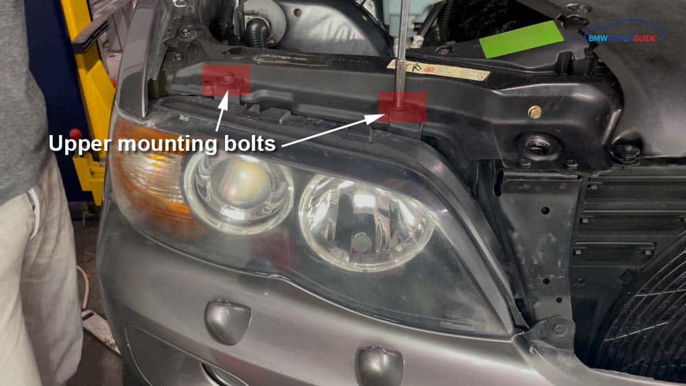 bmw e53 headlight bulb replacement - Remove the upper mounting bolts