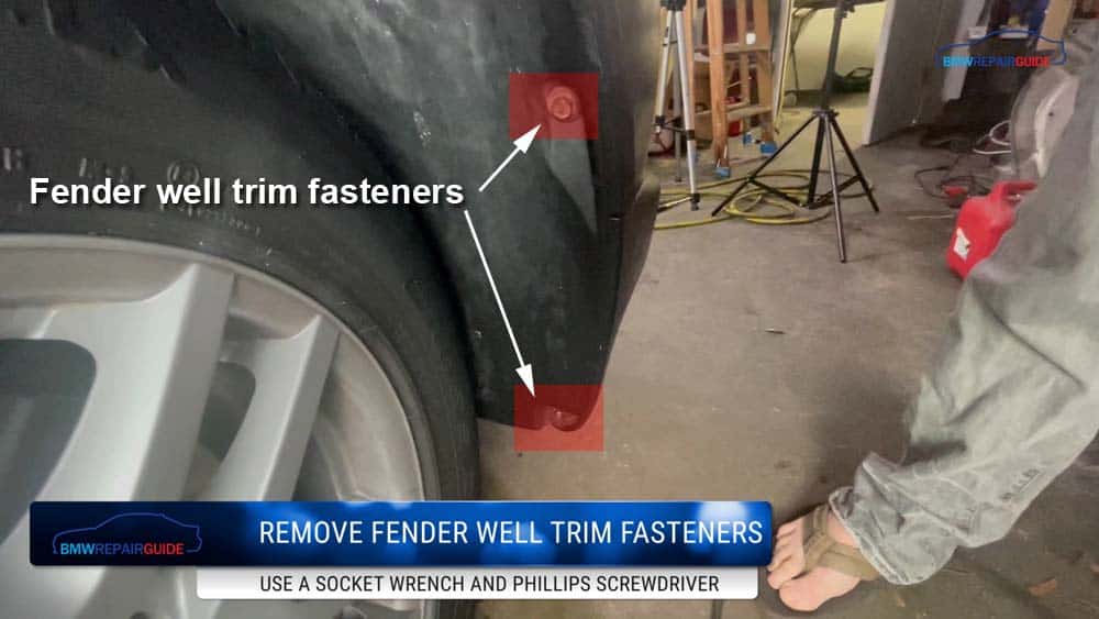 Remove the fender well fasteners so the trim can be folded back