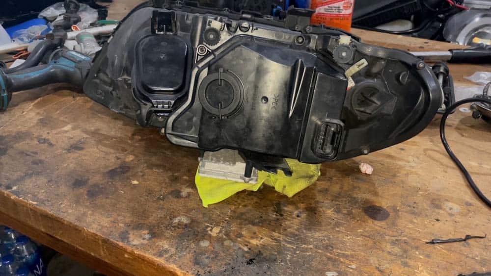 Place the X5 headlight assembly on a bench
