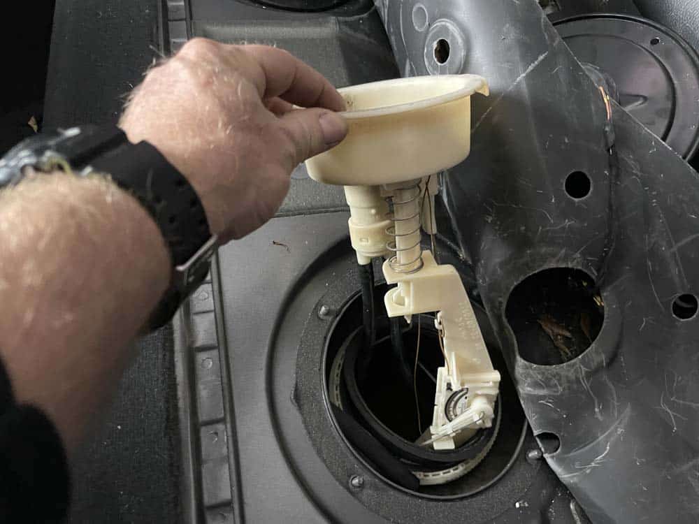 Remove the fuel level sensor from the tank
