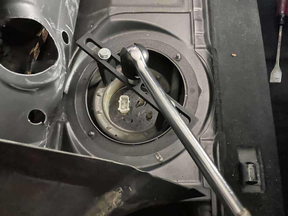 Use a fuel pump tool to remove the locking ring