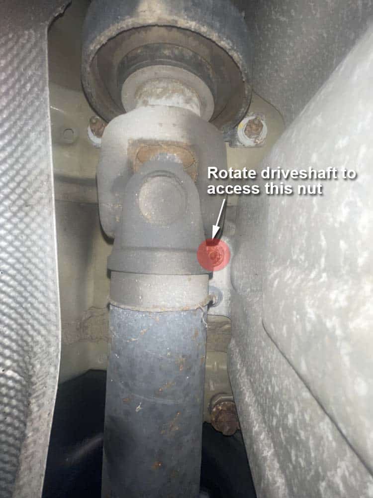 Rotate driveshaft if necessary to reach mounting nuts