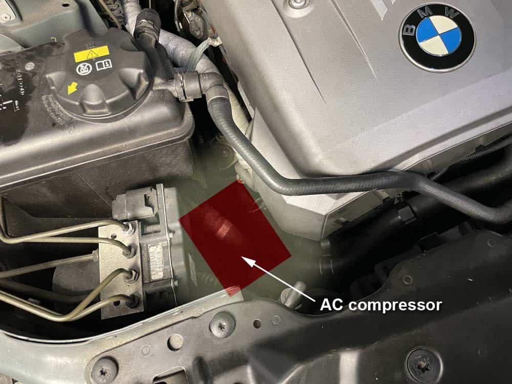bmw e60 ac compressor replacement - Locate the AC compressor at front right side of the engine