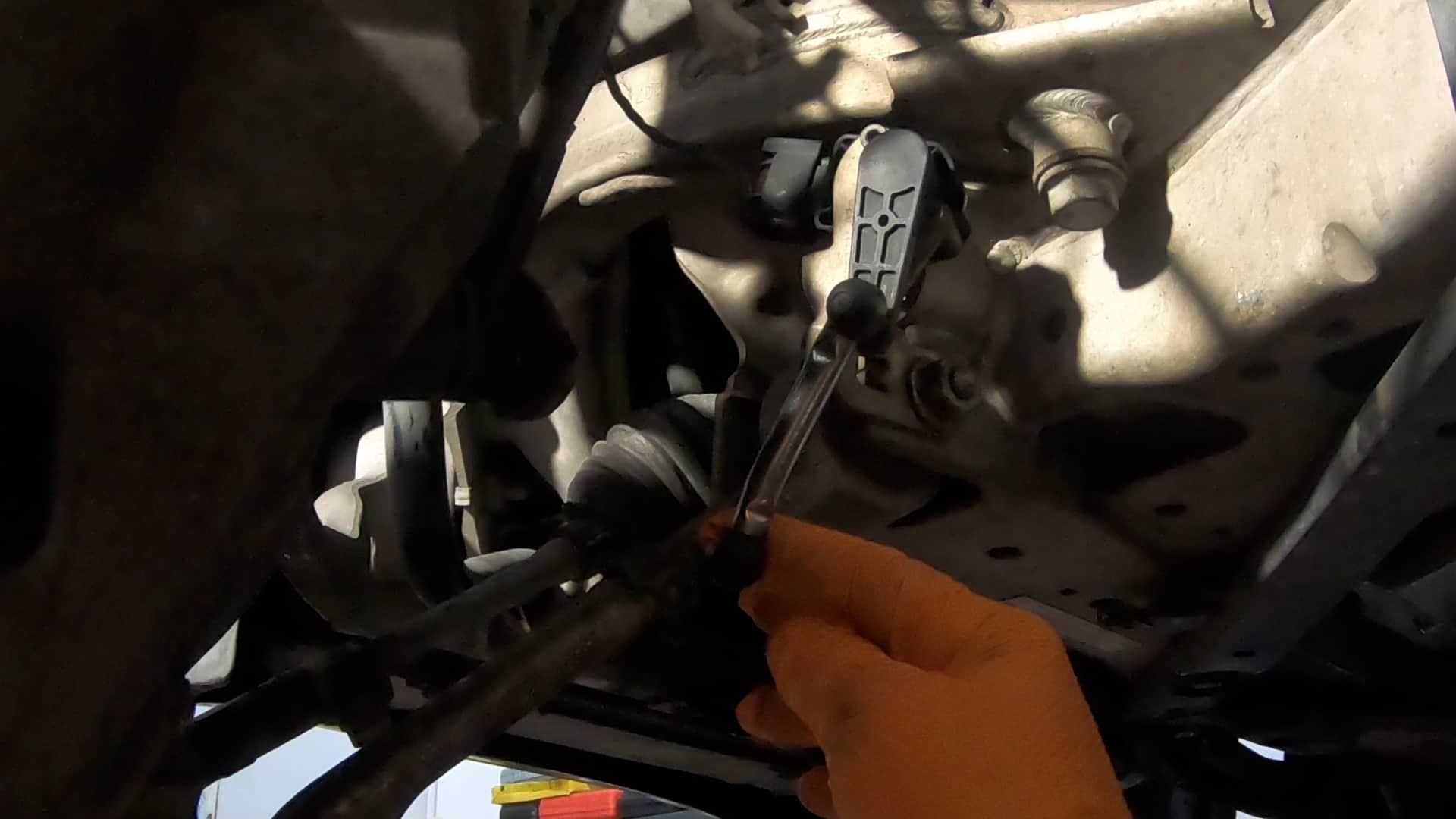 bmw e90 front strut replacement - Disconnect the self-leveling headlight sensor arm