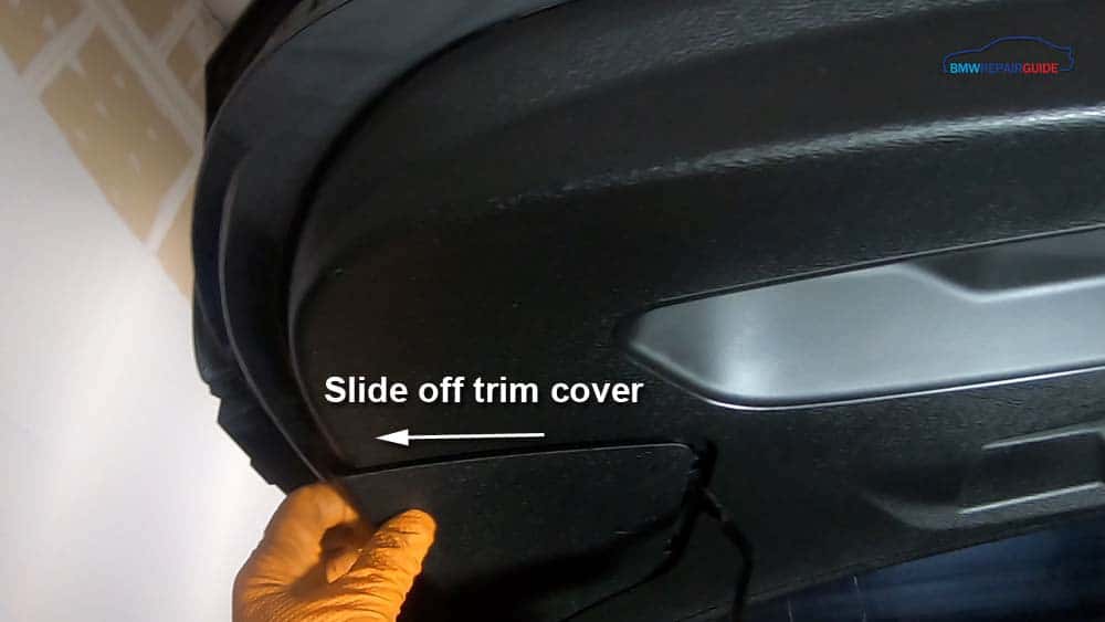Slide off trim cover on rear of the tail gate