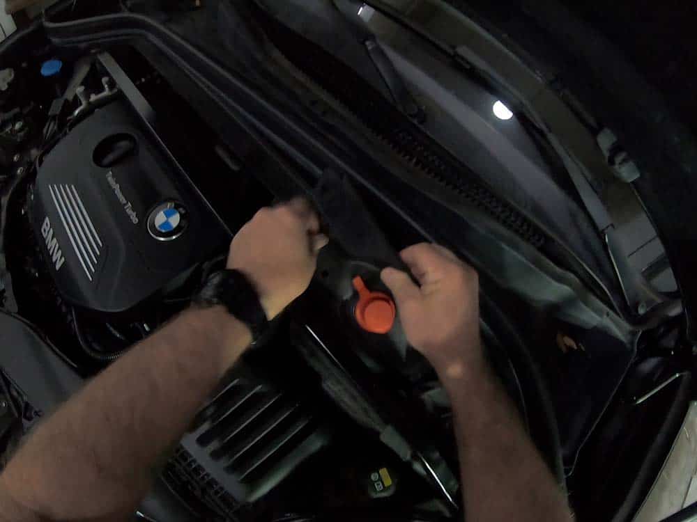 bmw x2 battery replacement - Remove the protective plastic battery cover