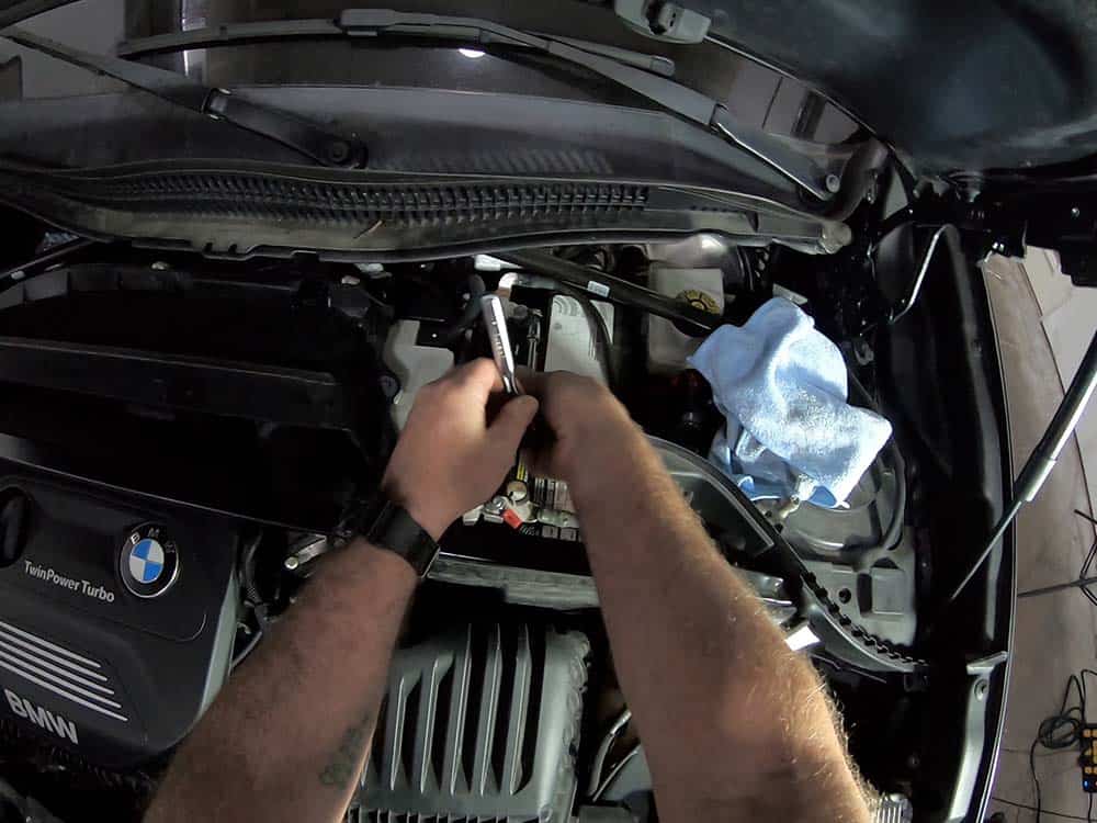 bmw x2 battery replacement - Remove the rear negative battery cable using a 10mm socket