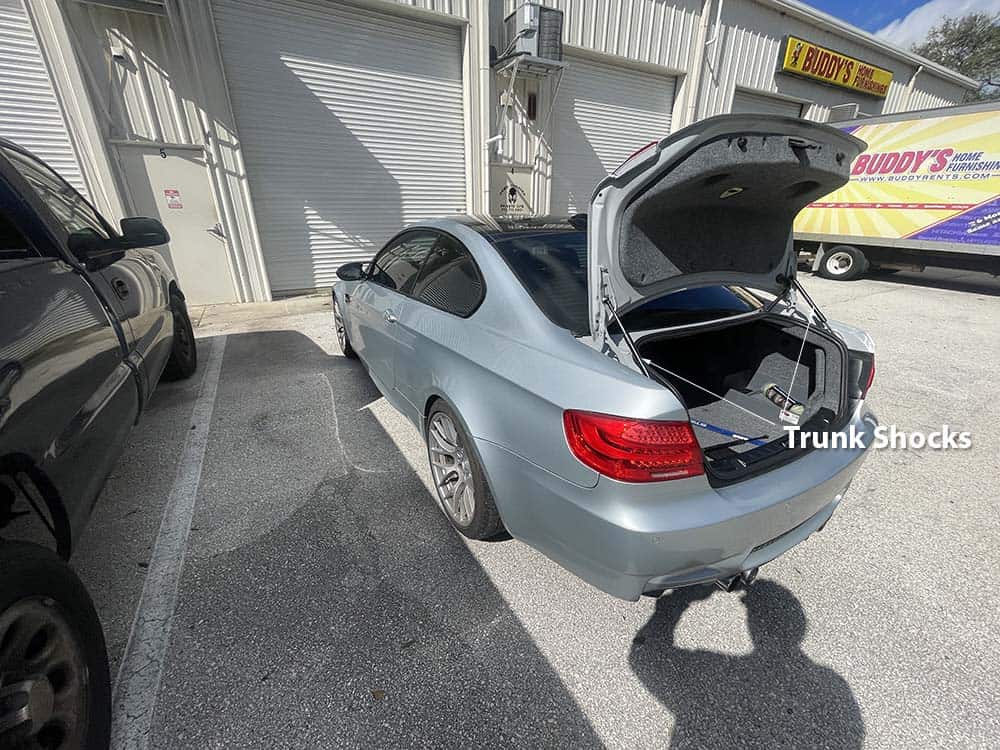 bmw trunk shock replacement - identify the rear trunk shocks with the trunk lid open