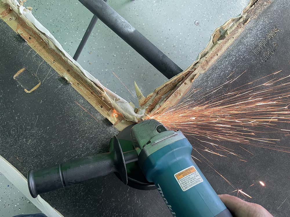 We used an angle grinder to remove the metal rail.
