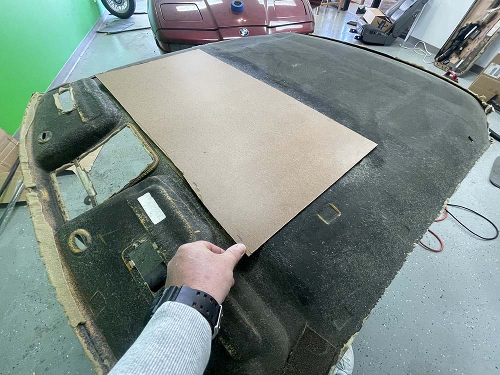 Firmly glue the masonite panel into place